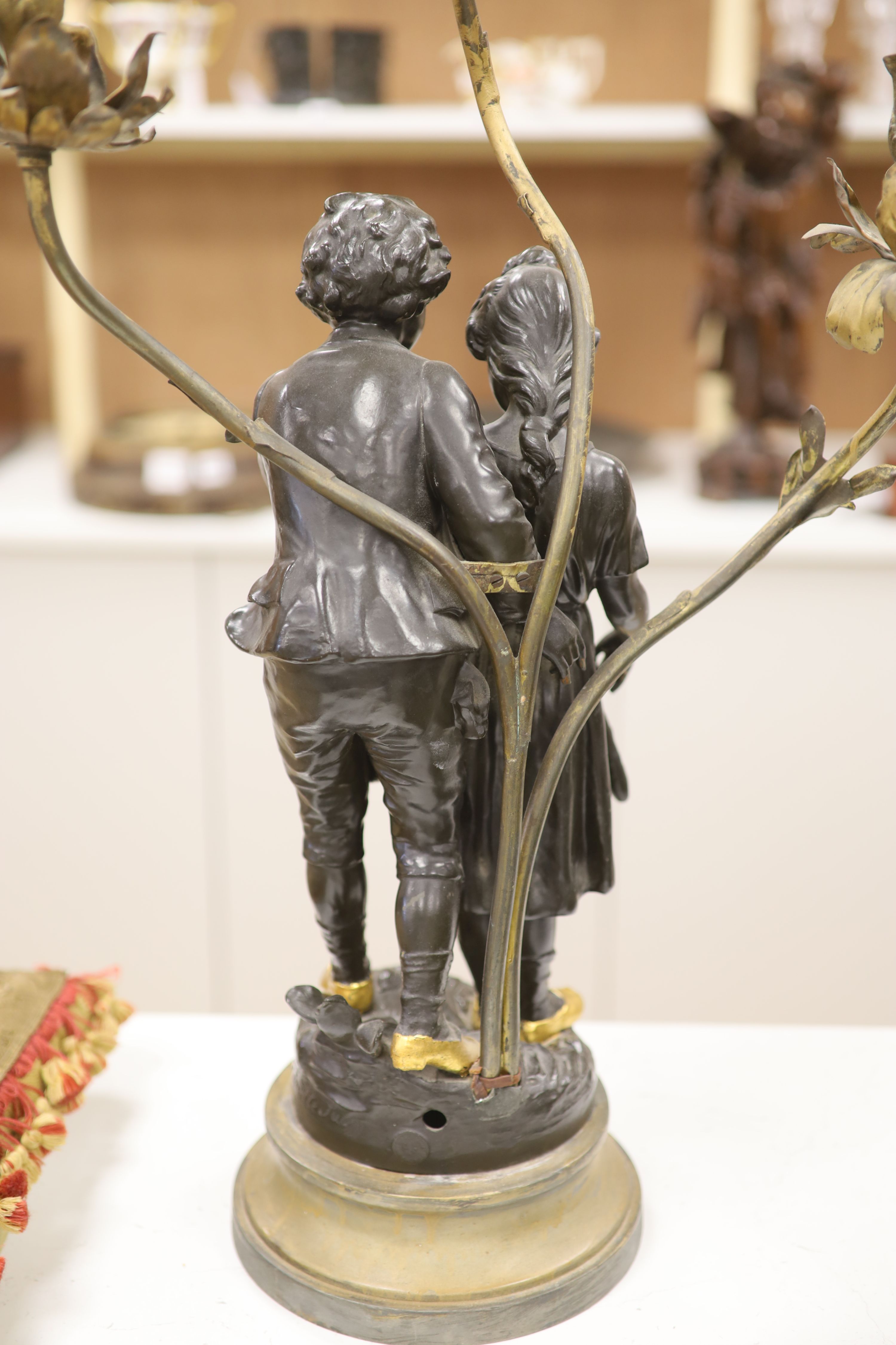 A spelter figural three branch candelabra, height 71cm